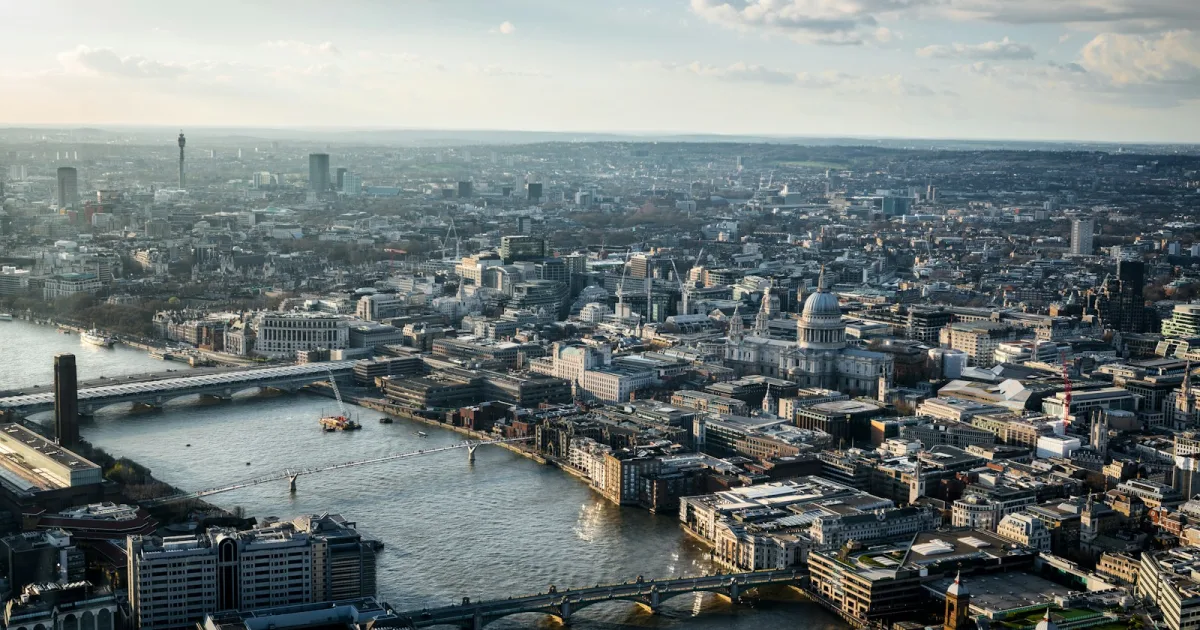 Aerial view of the City of London and the River Thames on a cloudy afternoon