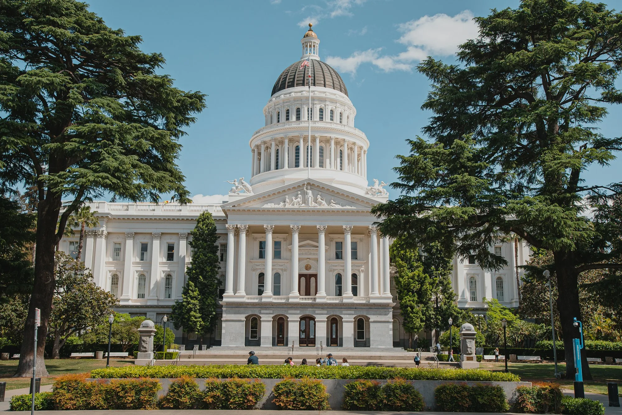 The dome of the California State Capitol in Sacramento under a blue sky